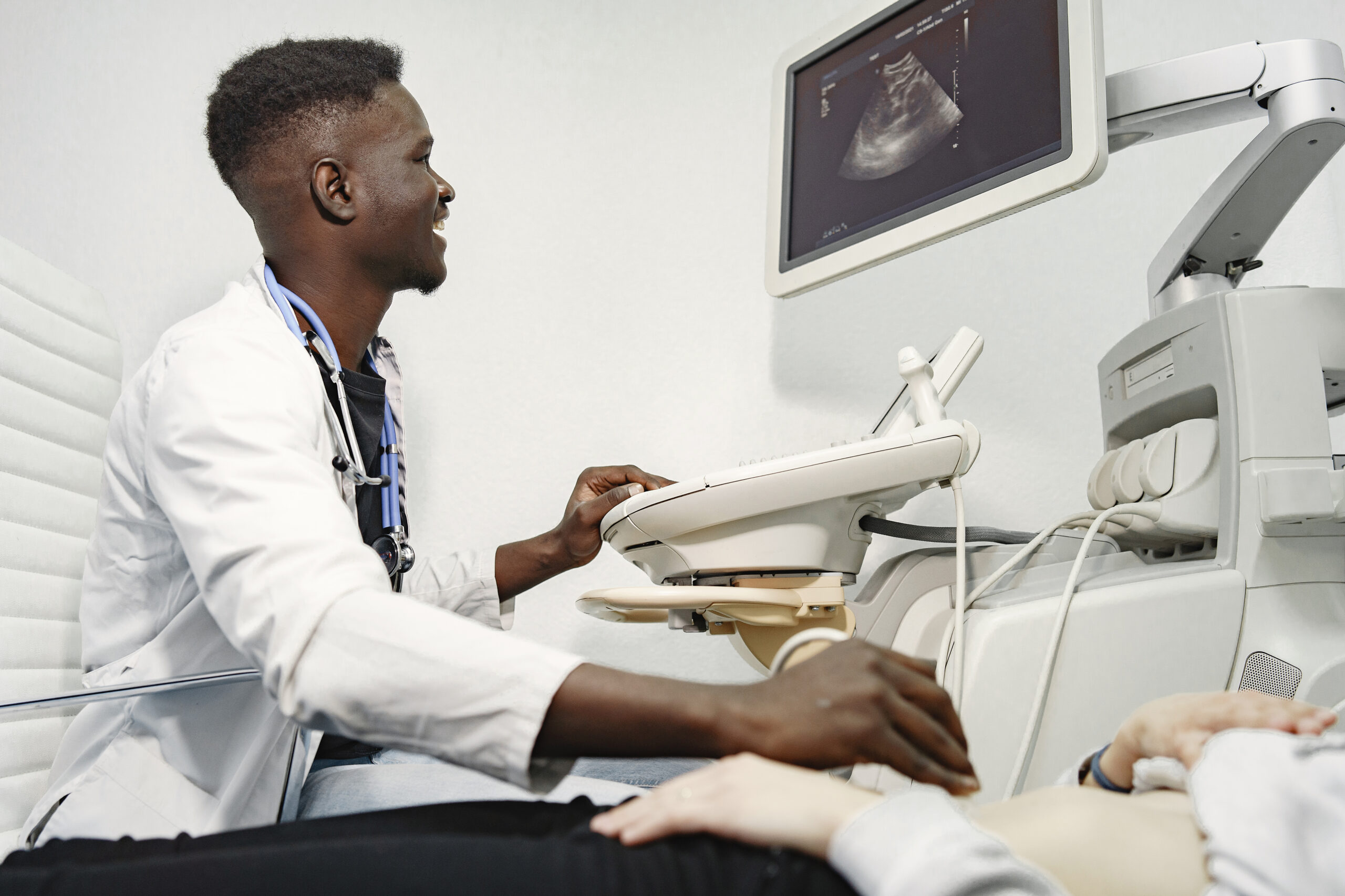 a doctor makes an ultrasound diagnosis
